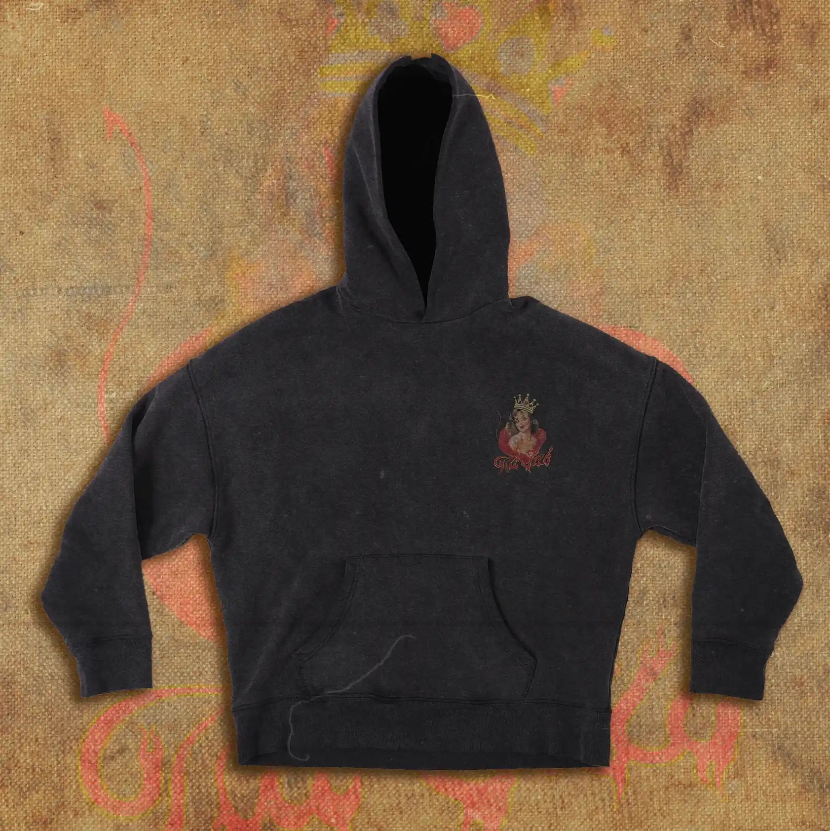 Black hoodie with a small chest design featuring a crowned devilish pin-up girl in red, accompanied by the words 'Tilt Club' in a bold, vintage-inspired font.