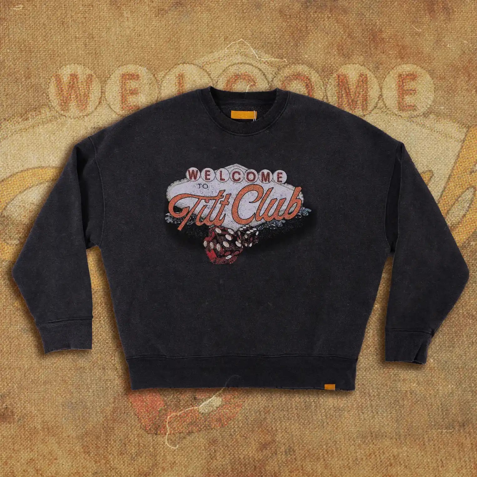 Vintage-style black sweatshirt featuring a 'Welcome to Tilt Club' Las Vegas-inspired graphic with dice illustration on the front. Retro and bold design for casual wear.